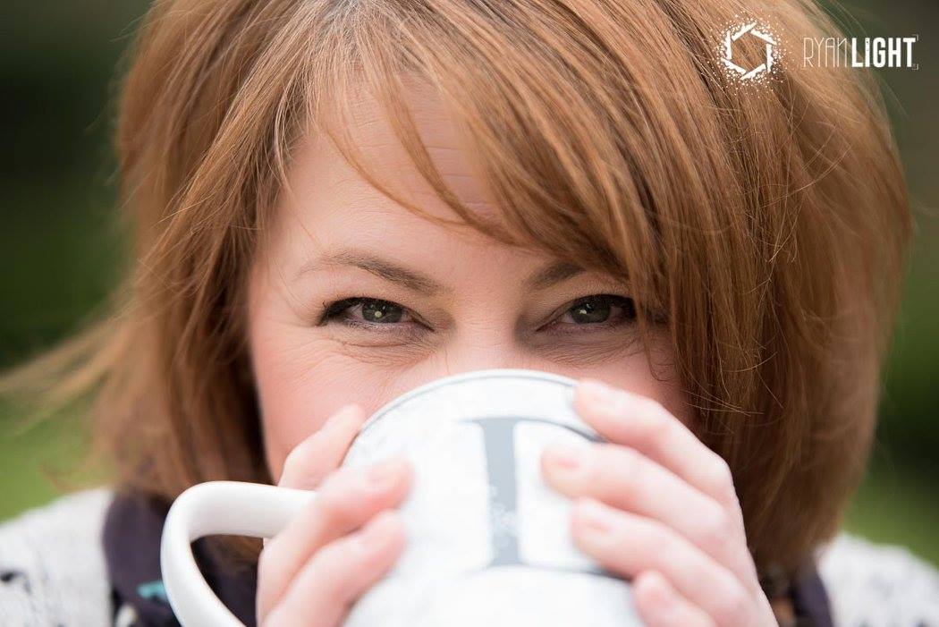 Dusty is posing with her mug with the letter D, pretending she is taking a sip of a hot drink on this crisp Fall day. She is a blogger, the heart & soul behind LinenandWildflowers.com photo taken by Ryan Light.