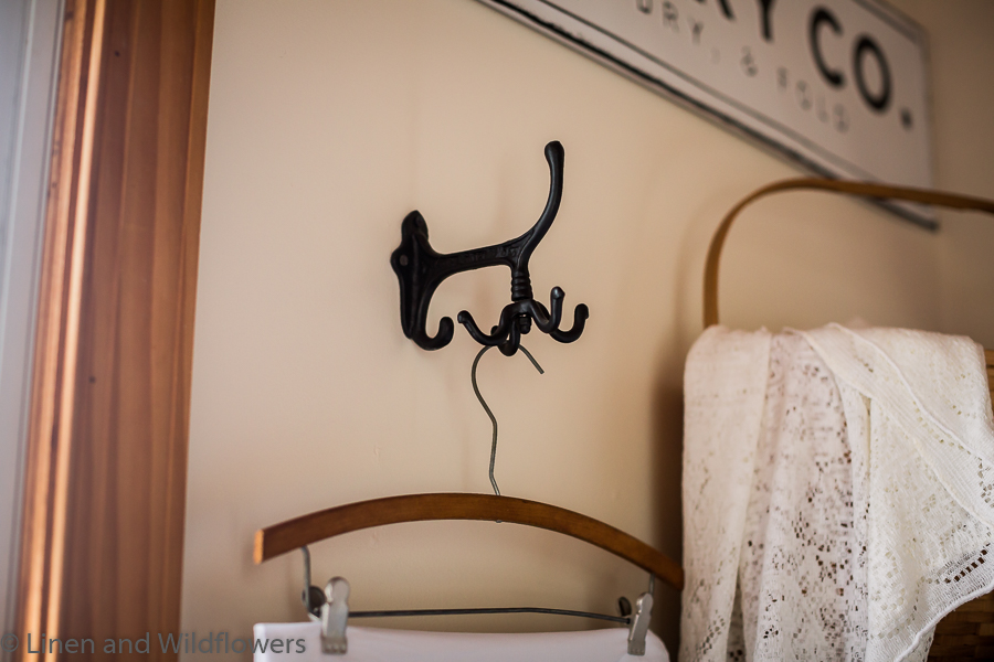Cast iron hook with an antique hanger with a linens