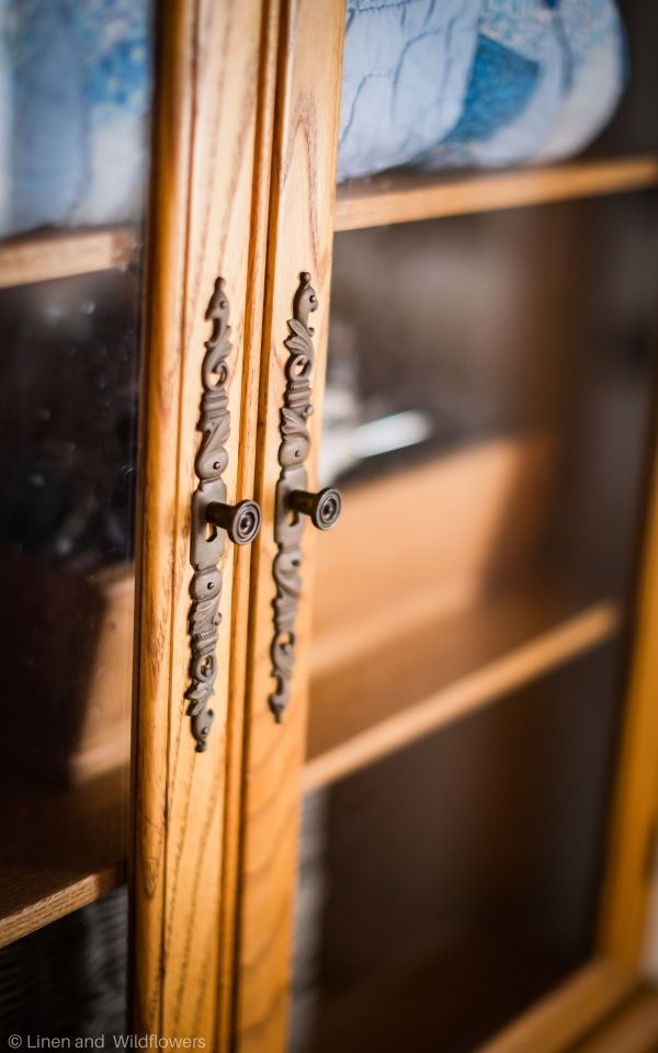 An antique stepback cupboard that is made with maple wood from 1910-1920 with vintagehardware.