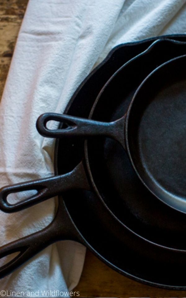 16 Useful Kitchen Tips-three cast iron skillets next to a te towel