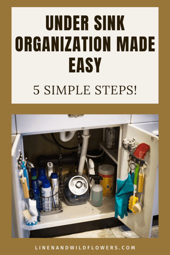 Alt text: "Under-sink cabinet neatly organized with cleaning supplies in baskets and hooks on the door. Text above reads 'Under Sink Organization Made Easy, 5 Simple Steps!' A tidy, practical storage solution."