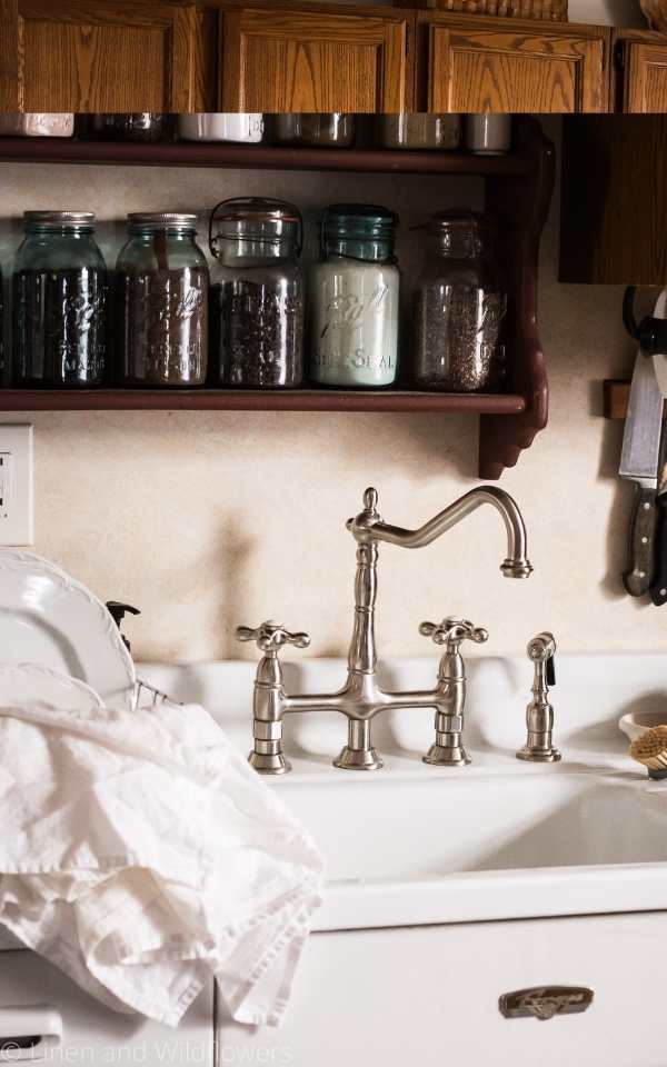 Vintage Sink Review 1 Year Later about a farmhouse-style sink with a fancy faucet in a 1885 house.