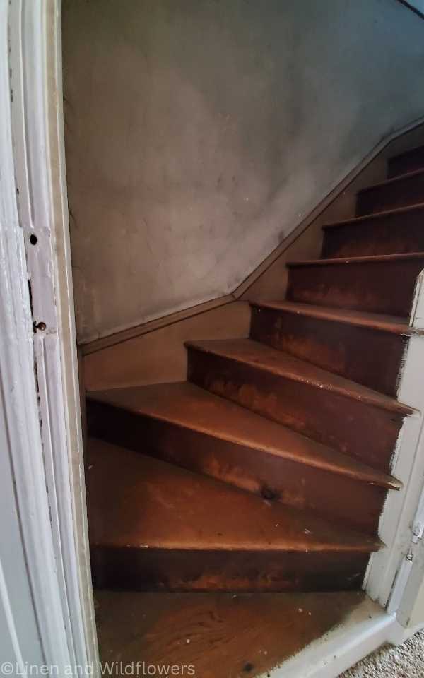 Our 1885 Historic Home-original wood steps leading into an attic from 1885
