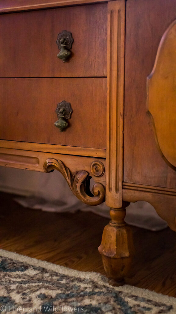Sideboardwith carved details on the fron cabinets & patinaed brass hardware.