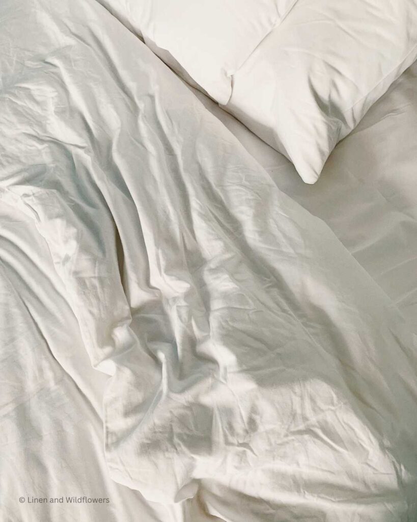 Clean white linens on a bed