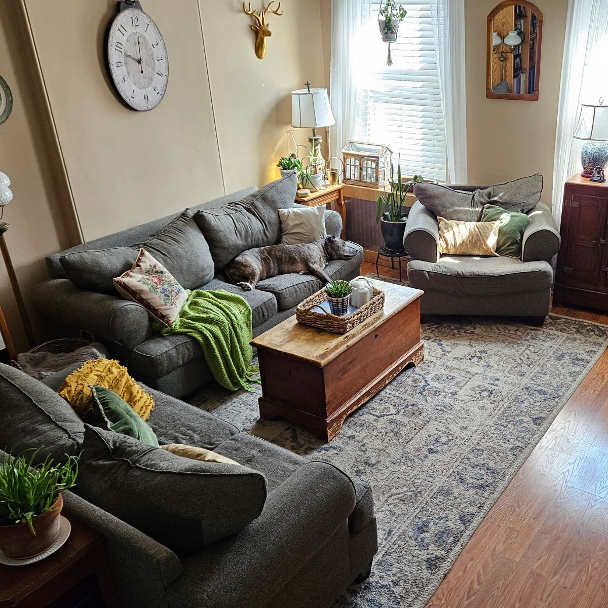 A living room filled with antiques & vintage decor with a cozy & inviting atmosphere.