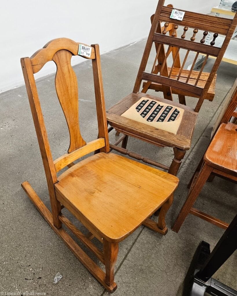 Small vintage wooden rocking chair with a $4.99 price tag, a charming thrifted accent piece for cozy home décor.