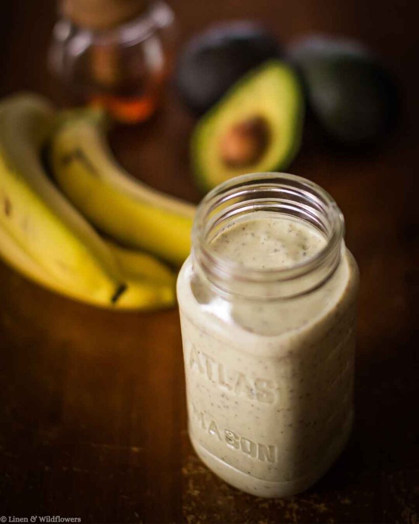 Creamy banana avocado smoothie in a vintage Atlas Mason jar, a healthy breakfast hack with ripe bananas and avocado.