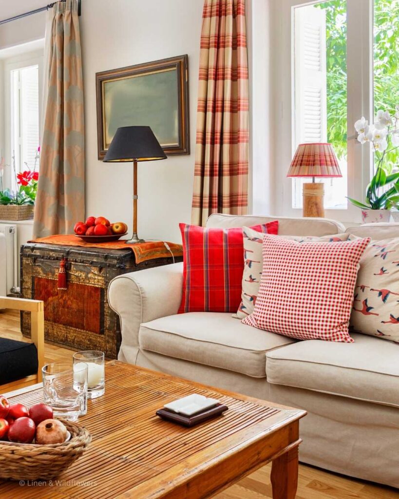 A English Country Style living decorated in bright colors & patterns. Makes ita  cozy & inviting space!