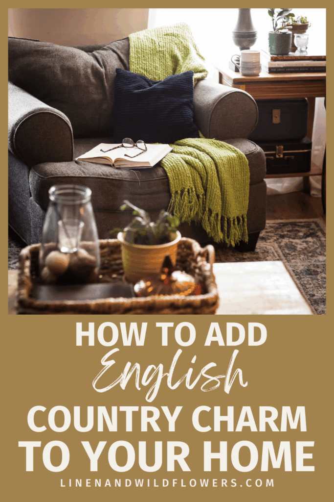 Cozy living room with a gray armchair, green throw, and navy pillow. Open book and glasses on the seat. Basket with plants on the table. Warm, inviting ambiance.