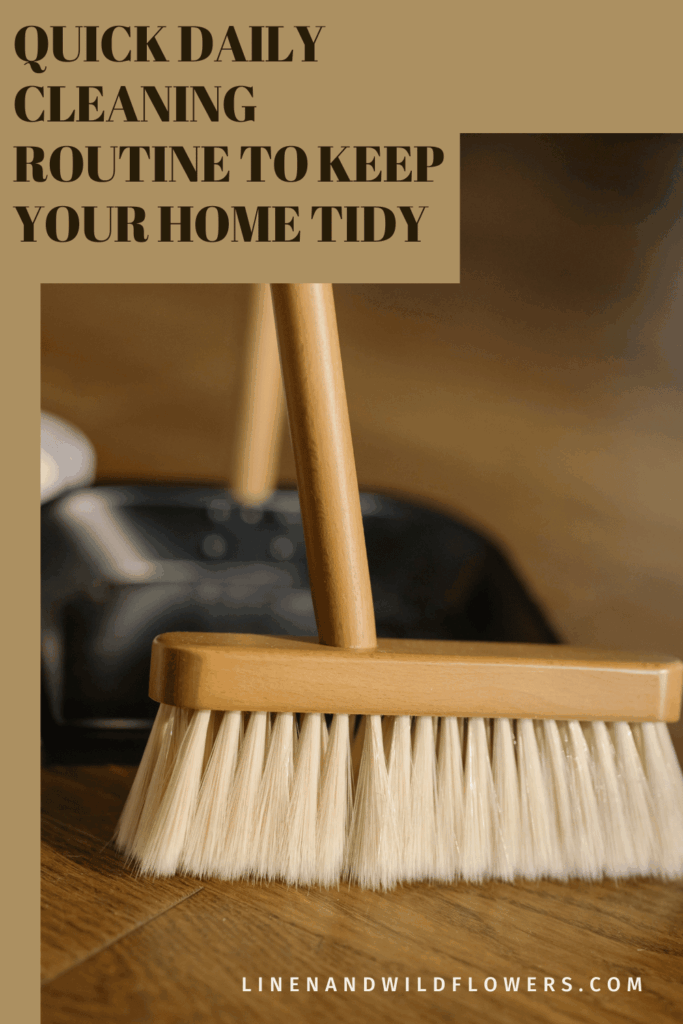 Quick daily cleaning routine to keep your home tidy pin showing a wooden broom with soft bristles and a black dustpan on a hardwood floor.