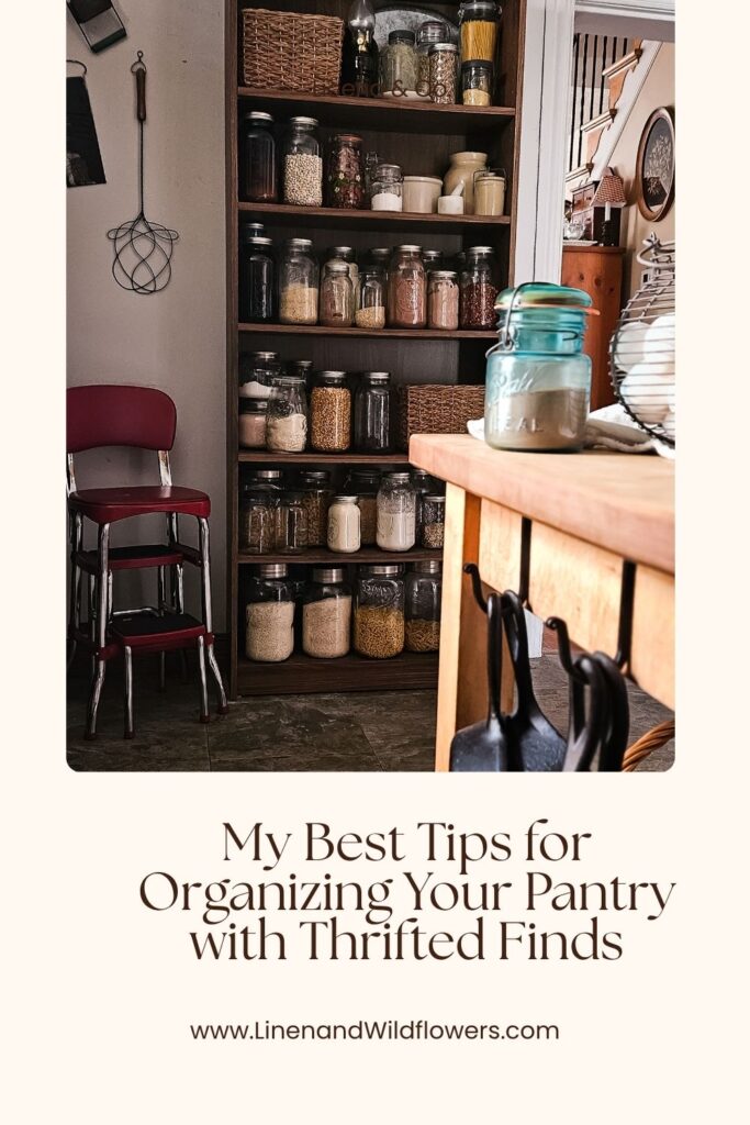 A Pinterest Image that shows a cozy kitchen pantry with wooden shelves filled with glass jars of various grains and spices. Vintage red chairs and kitchen utensil