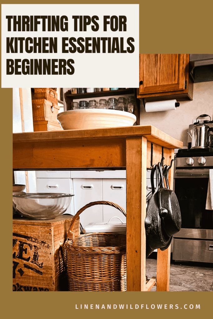 A cozy kitchen with wooden cabinets and a wooden island, featuring cast iron pans. Text reads “Thrifting Tips for Kitchen Essentials Beginners.”