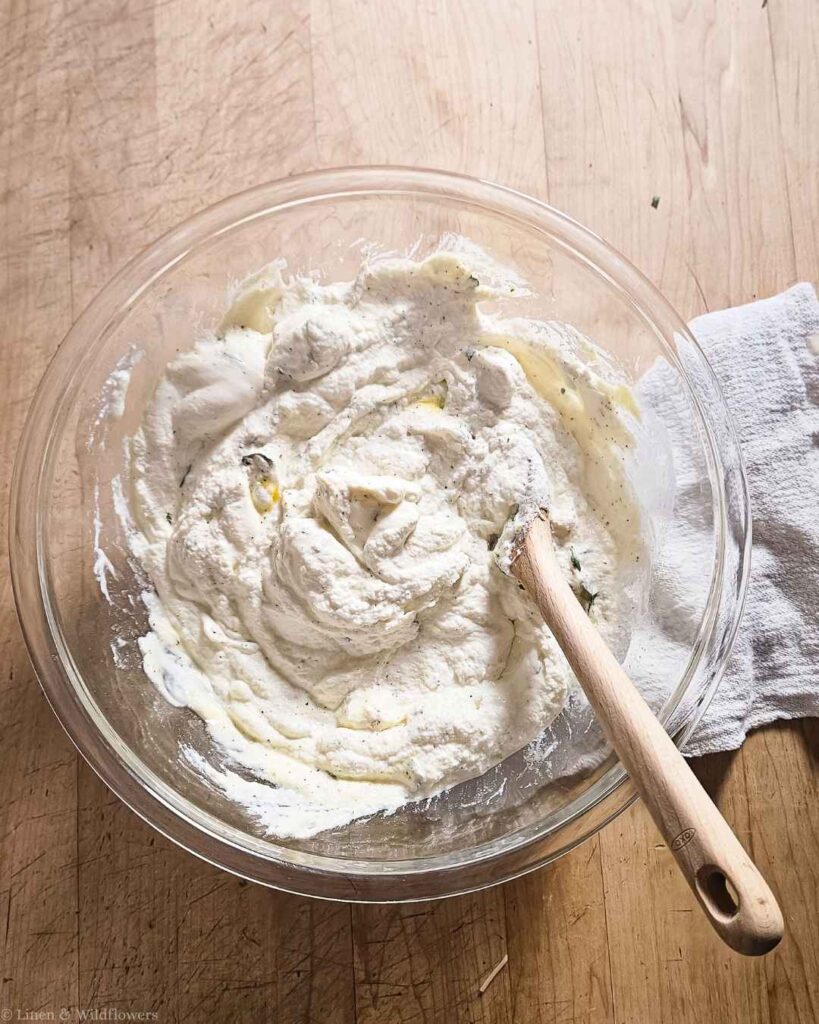 Shredded parmesan cheese added to the ricotta filling for turkey lasagna.
