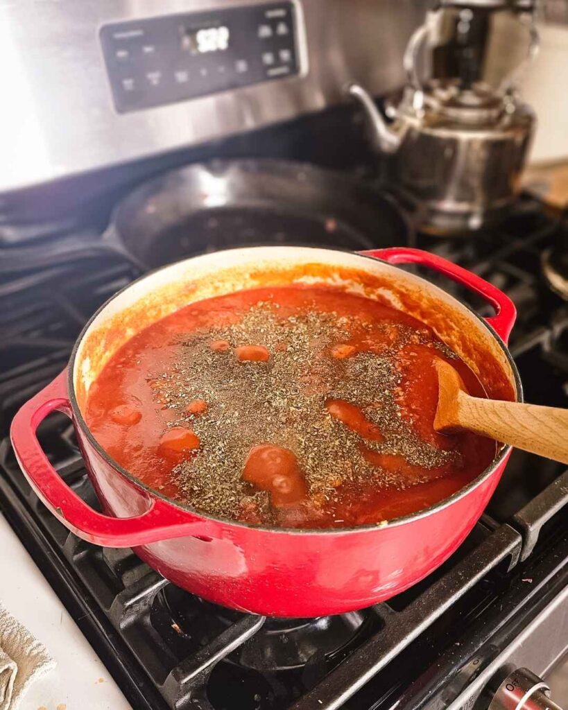 Turkey lasagna meat sauce simmering with crushed tomatoes and Italian seasoning.