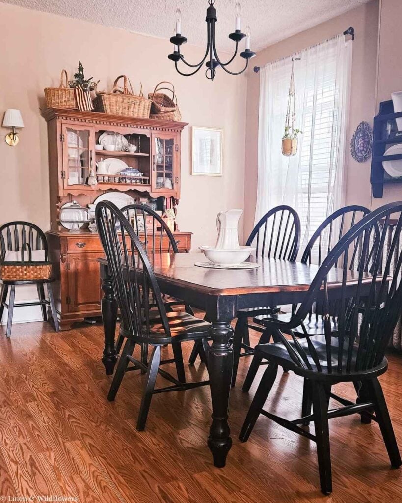 I found a beautiful $125 thrifted dining room table and Windsor chairs that completely changed the feel of our country-style dining room.